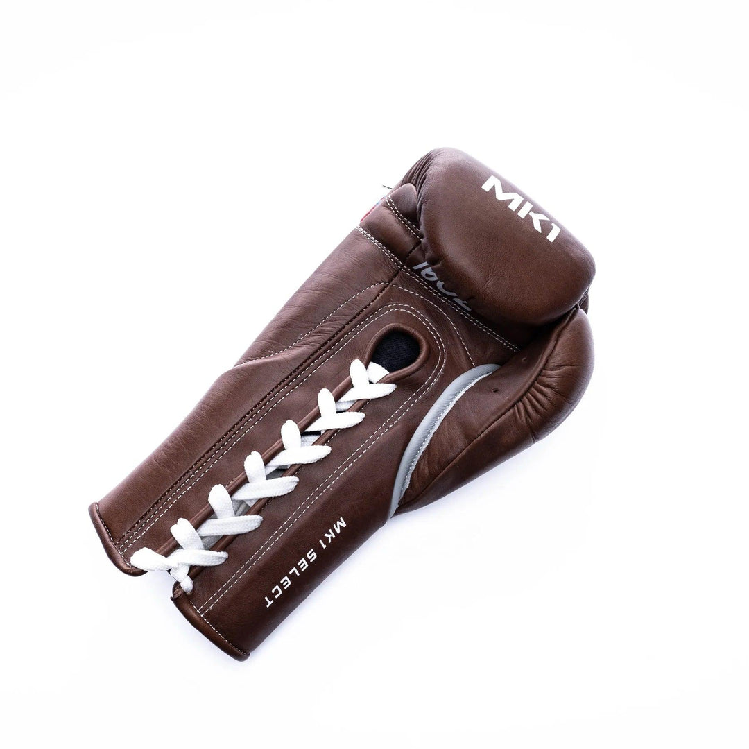 Vintage brown lace-up boxing gloves handcrafted in genuine leather with a lace-up closure.  