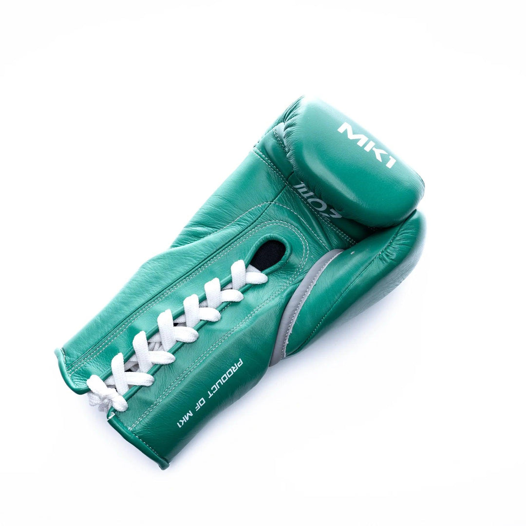 Teal lace-up boxing gloves handcrafted in genuine leather with a lace-up closure.  