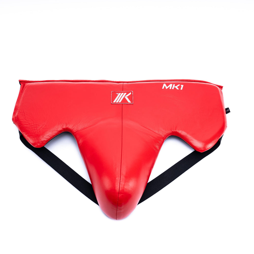 Red groin guard for boxing training and sparring.